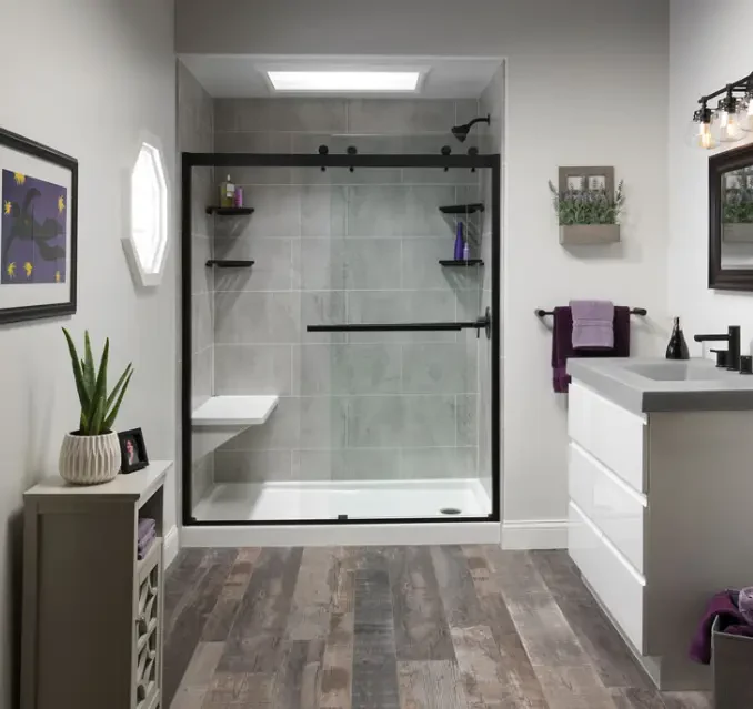 Bathroom with a sliding glass shower door and a built-in seat