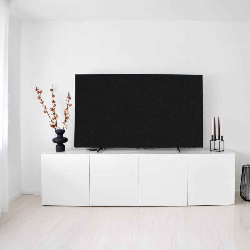 White TV cabinet in a living room