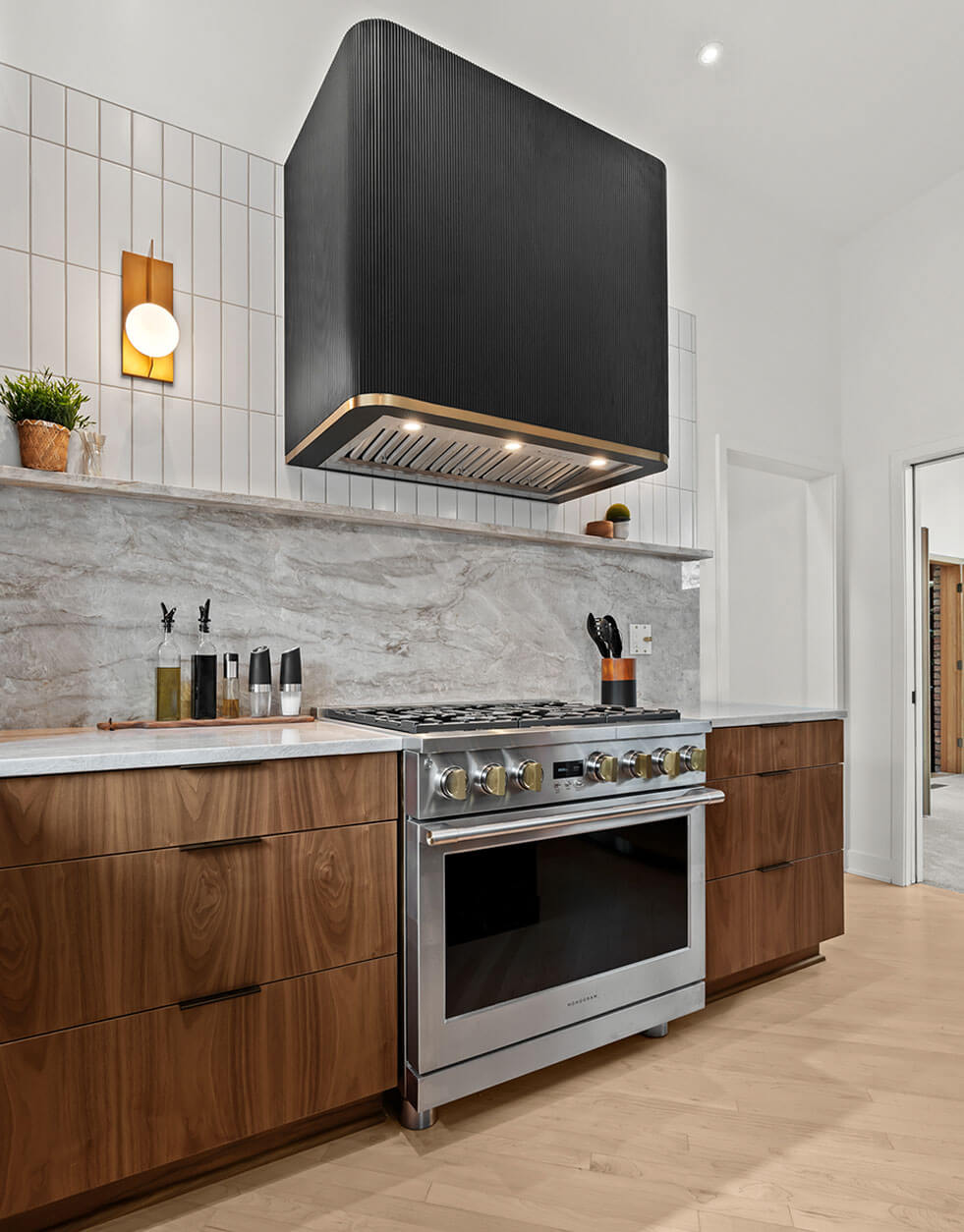 Walnut and black cabinetry with brass accents